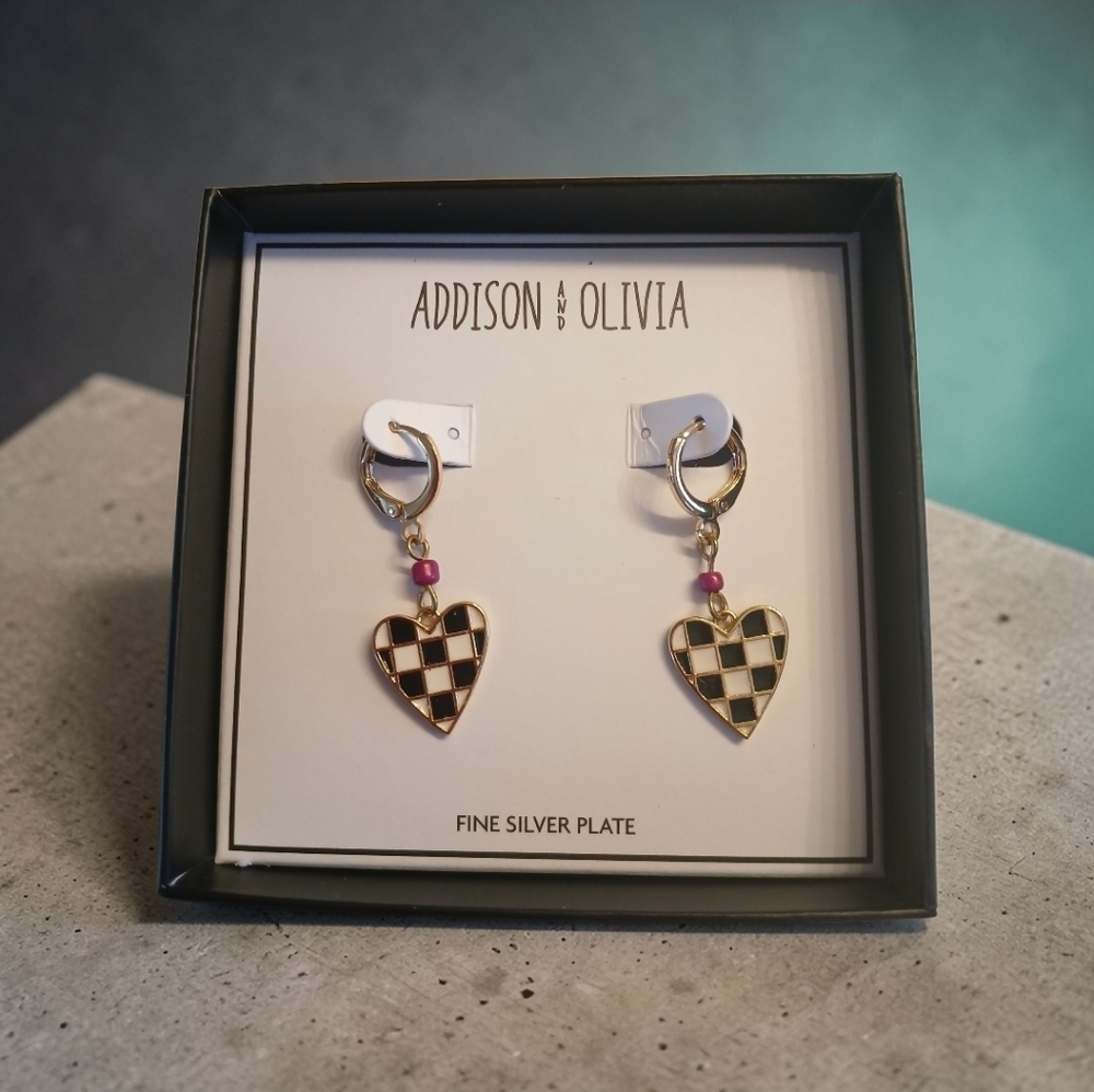 Addison & Olivia and feature black and white checkered heart charms 1.7"